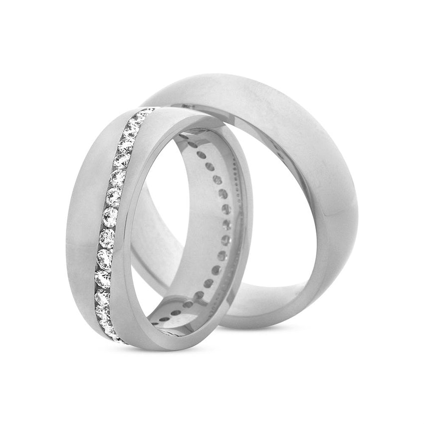 Eksklusiv Nuran vielsesringe i 14 karat hvidguld med 0,76 ct diamanter i bølget mønster – sæt.